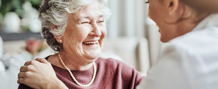 captures a warm and genuine interaction between two women, likely representing elderly care, companionship, or a positive medical consultation.